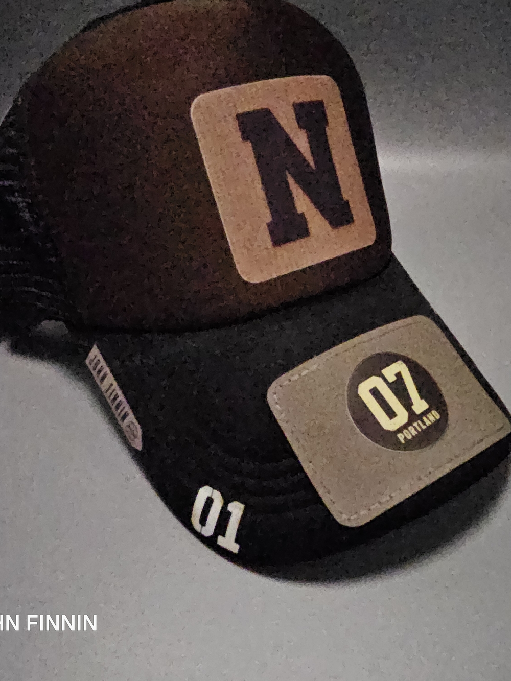 Men's Black Trucker Cap with Tan Patches - N Logo